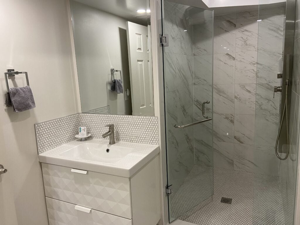 Furnished 2-bdrm, 1-bath walk-out basement unit with parking