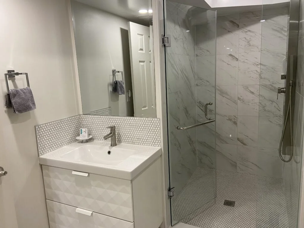 Furnished 2-bdrm, 1-bath walk-out basement unit with parking